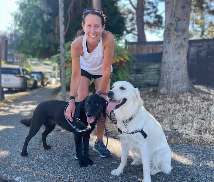 Natural, small batch CBD for dogs founder Kat with her dogs, Austin and Harper.